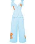Fanm Mon Collette Set in light lagoon featuring a scalloped sweetheart top with adjustable shoulder bows, floral embroidery, and wide-leg cropped trousers