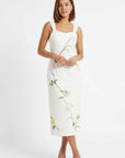 Model in the Bafra Dress a refined column dress adorned with winding botanical embroidery, designed for celebrations, special occasions, and timeless summer dressing.