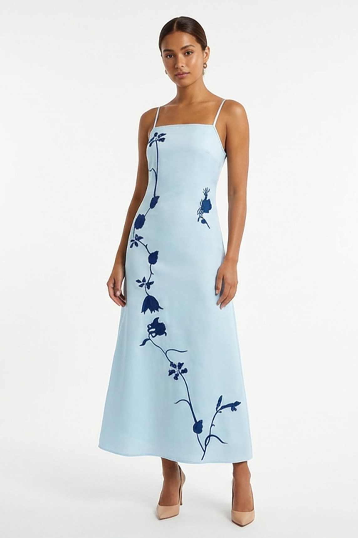 Fanm Mon Carmen Dress featuring oversized floral vine embroidery, adjustable spaghetti straps, and an elegant A-line maxi silhouette.