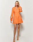 Fanm Mon Chorzele Dress on Model in Orange Cotton in front of white background