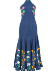 Embroidered halter midi dress featuring floral embroidery along the bodice and fluted hem panels.