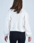 Back View of the Sister Bloom Cardigan in White