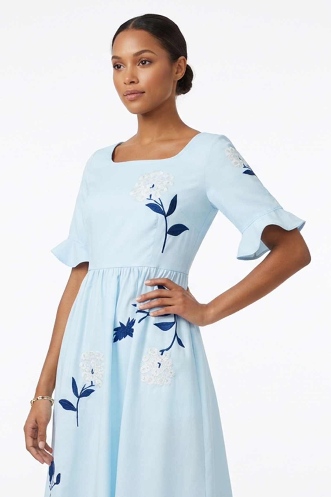 Close-up of the Yaprak Dress highlighting intricate hydrangea embroidery and botanical motifs.