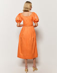 Backview of the Braga Dress by Fanm Mon, on Model, showcasing scoop back detail and back zipper closure. 