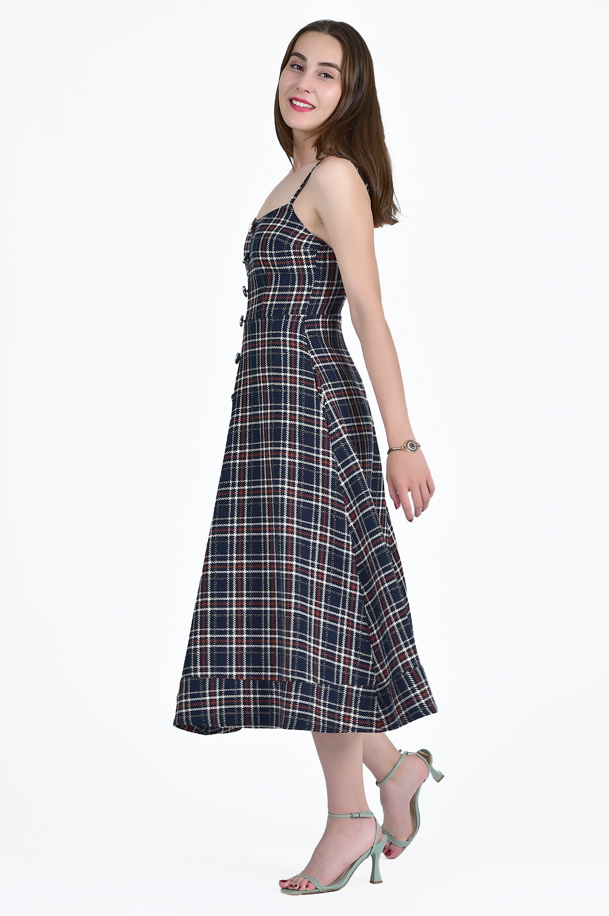 SIDE VIEW OF THE HURIYE DRESS IN NAVY TARTAN TWEED