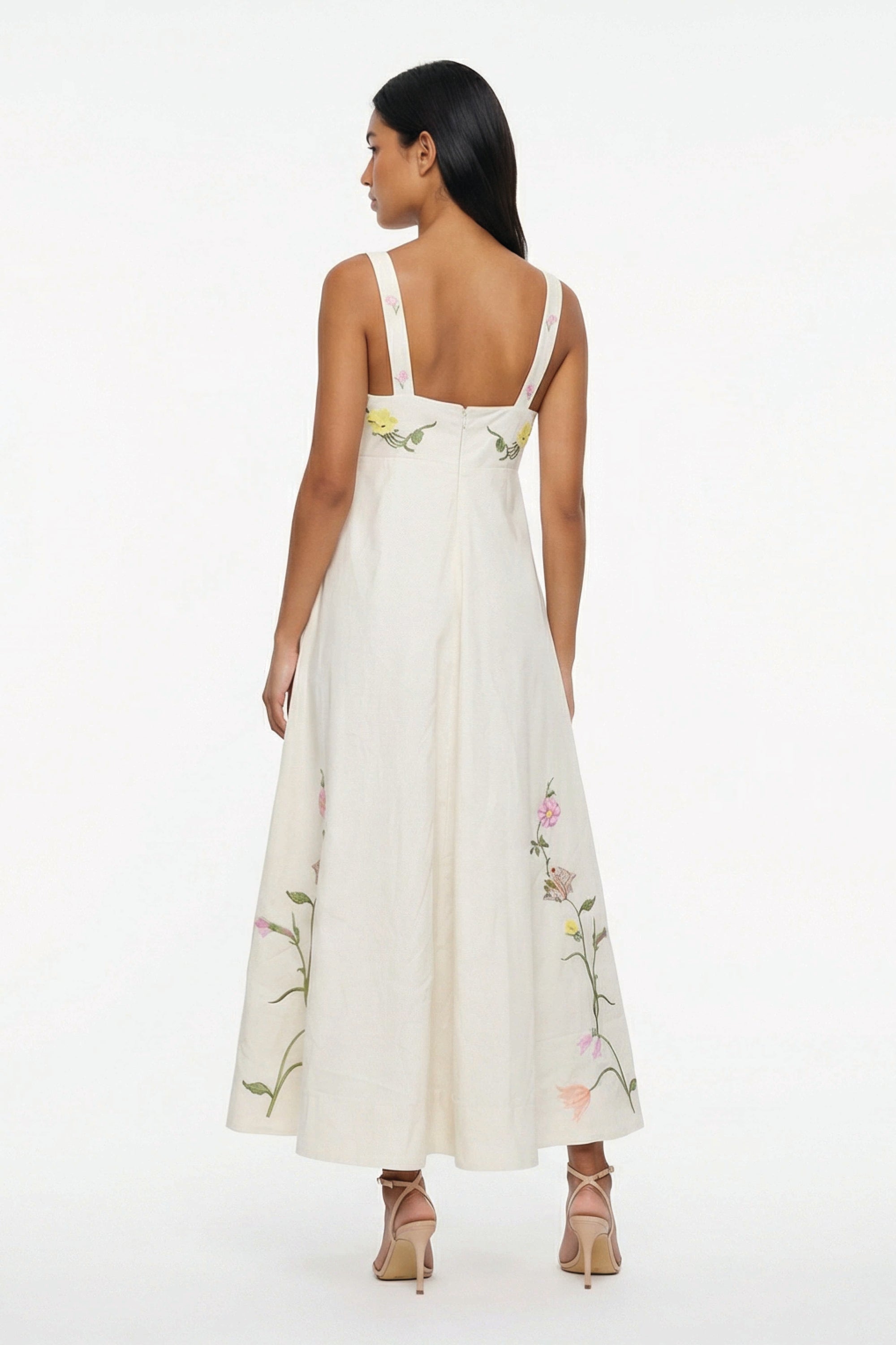 Back view of the Fanm Mon Leyla Dress showcasing embroidered shoulder straps, concealed back zipper, empire waist, and floral embroidery extending around the hem.