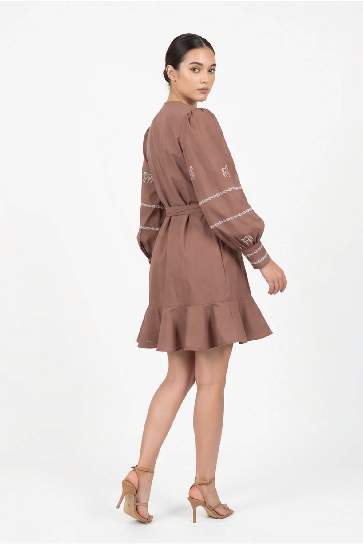 Fanm Mon Mel Dress back view featuring voluminous embroidered sleeves, a self-tie waist and ruffle hem.