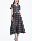 Fronti View of the Mihriban Dress in Navy Tartan Tweed with White Floral Embroidery Detail