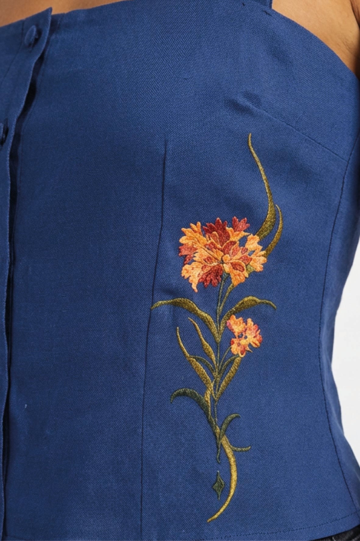 Fanm Mon Merva Top in deep blue with multicolor floral embroidery detail
