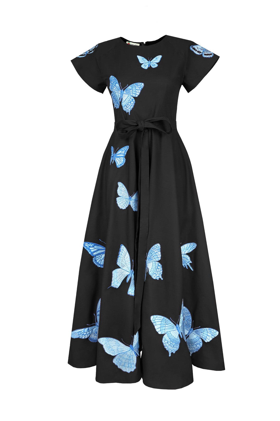 Fanm Mon Pulse Dress in black featuring contrasting blue butterfly embroidery, short flutter sleeves, a self-tie waist and full A-line midi skirt.