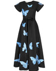 Fanm Mon Pulse Dress in black featuring contrasting blue butterfly embroidery, short flutter sleeves, a self-tie waist and full A-line midi skirt.