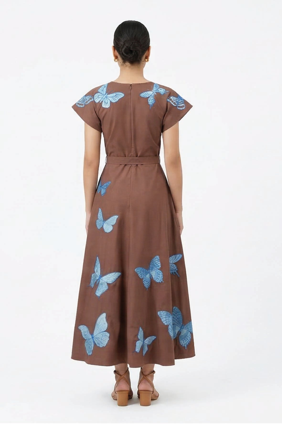 Fanm Mon Pulse Dress back view featuring blue butterfly embroidery, short flutter sleeves, a defined waist and full A-line midi skirt.
