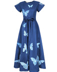 Fanm Mon Pulse Dress in indigo blue featuring tonal blue butterfly embroidery, short flutter sleeves, a self-tie waist and full midi skirt.
