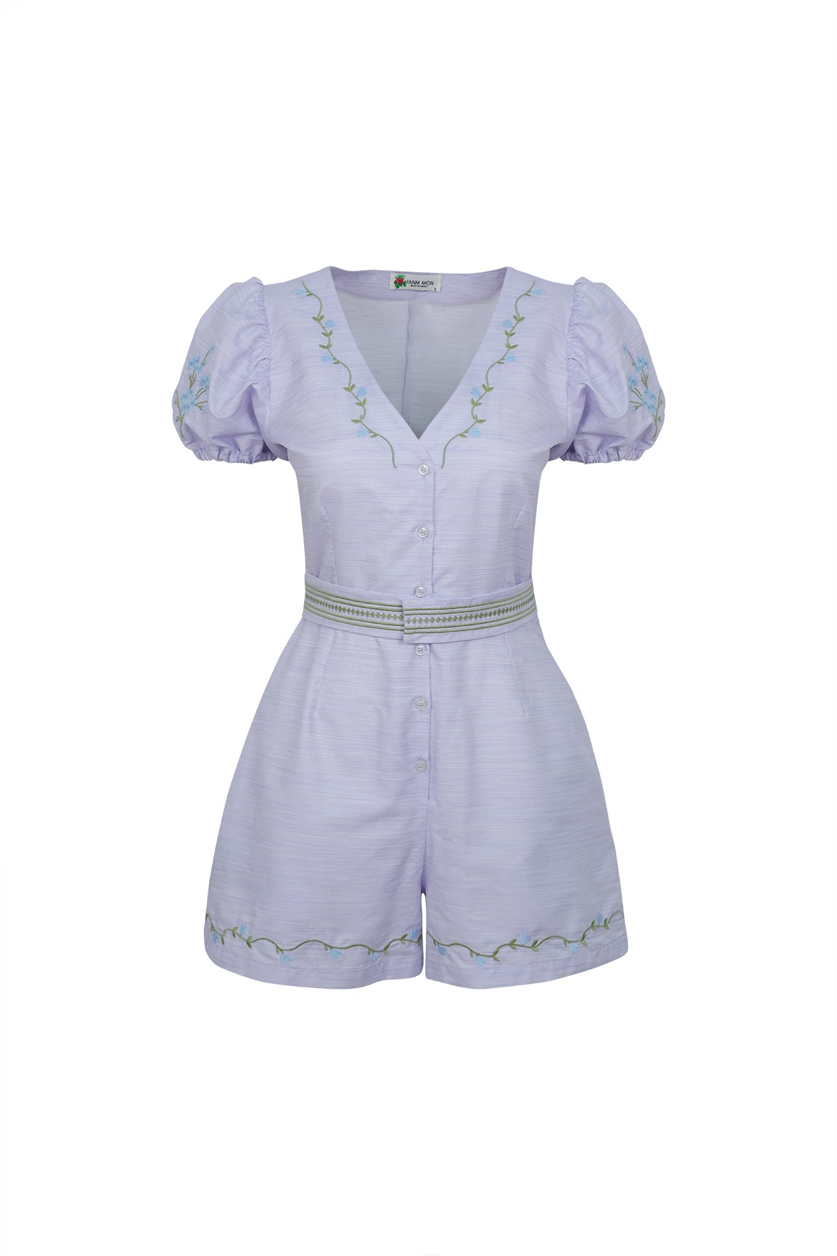 Light purple romper with decorative buttons and waistband on a white background. Fanm Mon Rabia Romper.