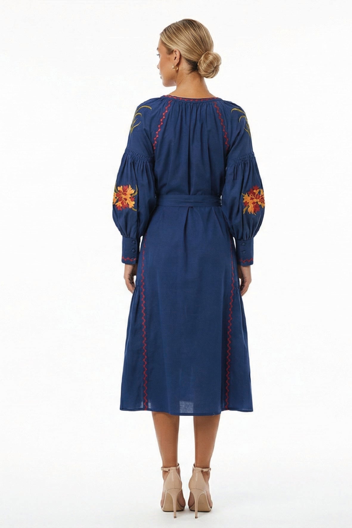 Back view of the Fanm Mon Raya Dress featuring voluminous embroidered sleeves, contrast stitching, and a self-tie waist.