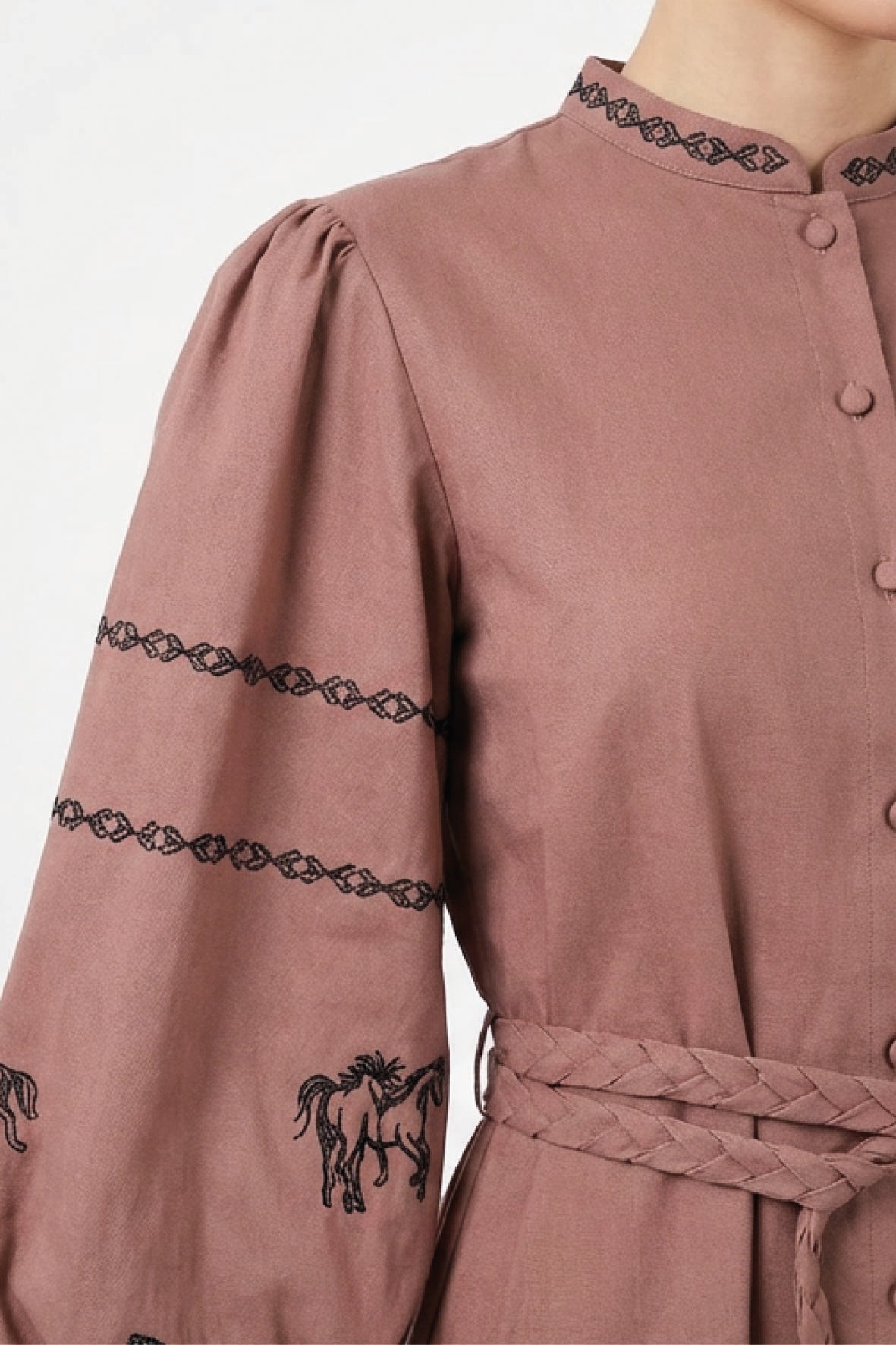 Close-up of the Fanm Mon Sakura Dress featuring black horse motifs, intricate embroidered sleeve bands, embroidered stand collar, and a braided waist belt.