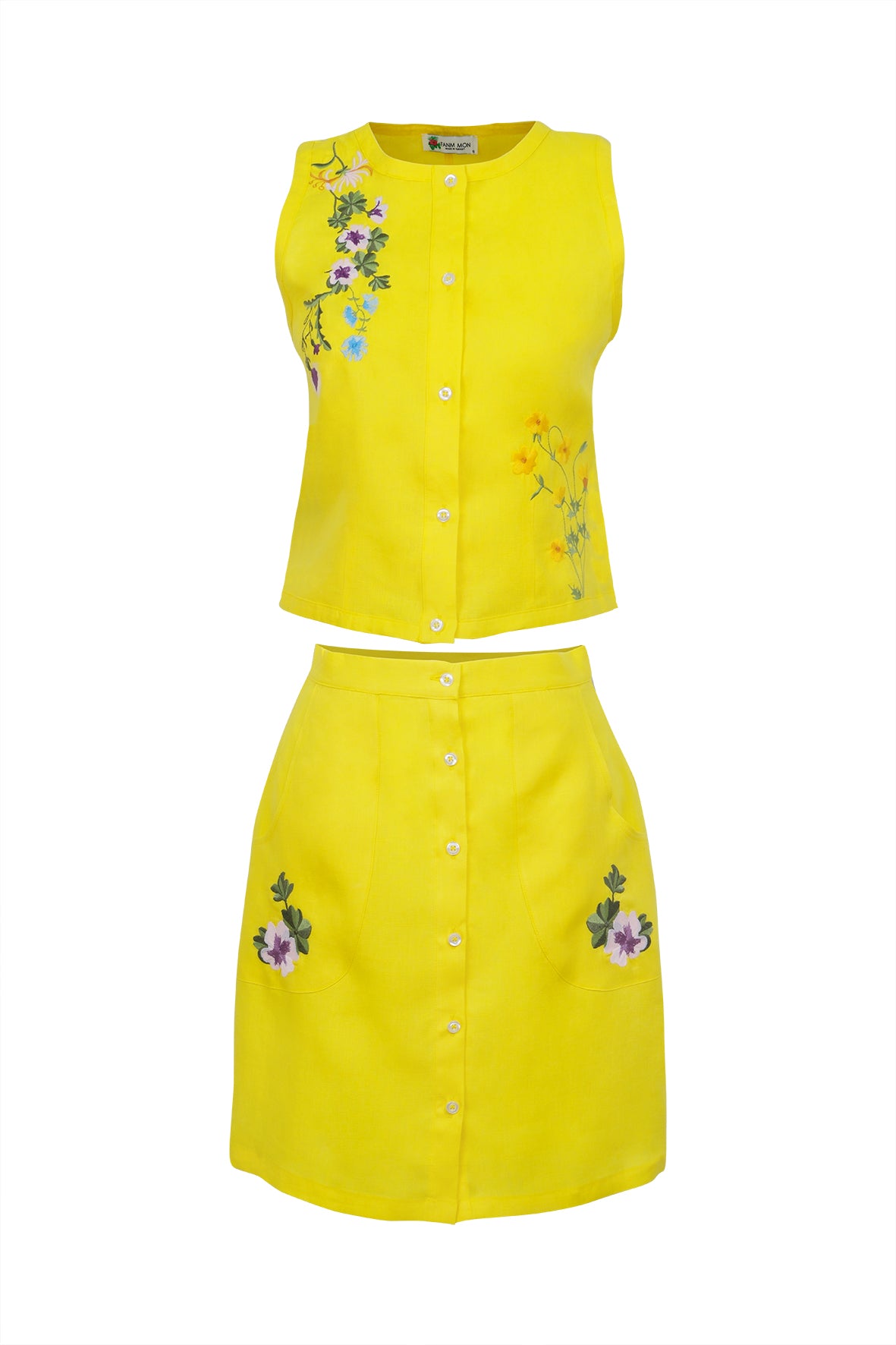Yellow sleeveless top and skirt set with floral embroidery on a white background. Fanm Mon Sema Set.