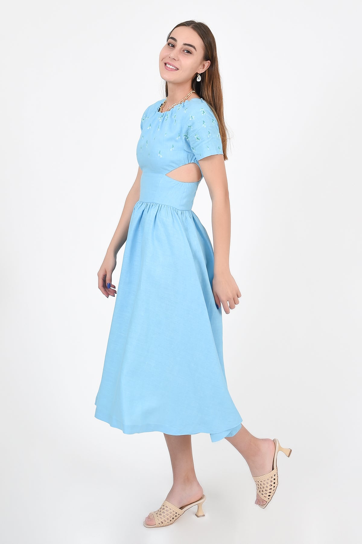 Tucce Linen Dress, Side view, showcasing side cutout details.