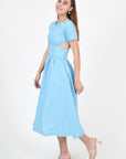 Tucce Linen Dress, Side view, showcasing side cutout details.
