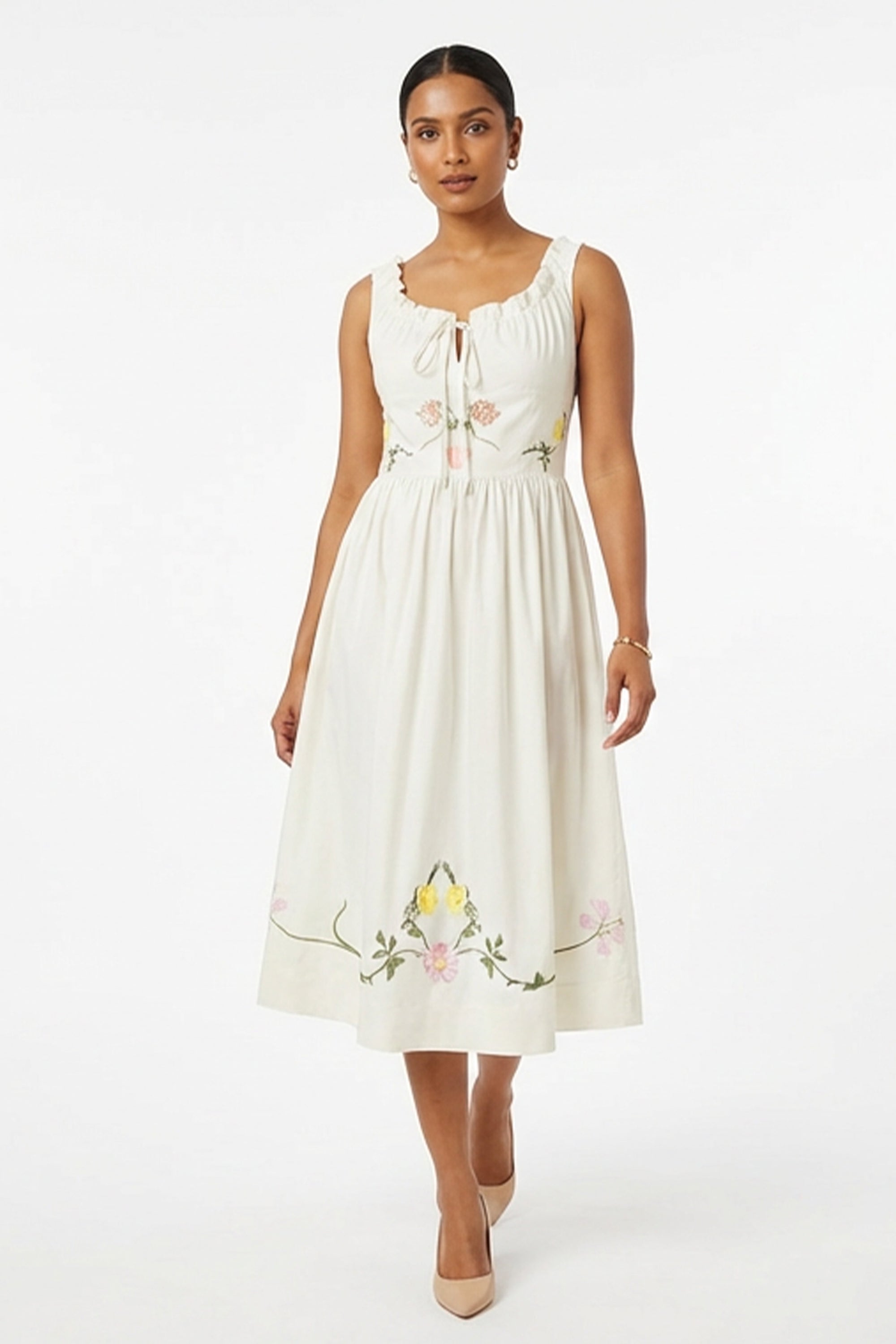 Model wearing Fanm Mon Veda Dress showcasing the gathered neckline, embroidered floral motifs, fitted bodice, and flowing A-line midi silhouette.