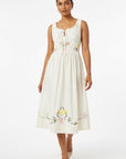 Model wearing Fanm Mon Veda Dress showcasing the gathered neckline, embroidered floral motifs, fitted bodice, and flowing A-line midi silhouette.