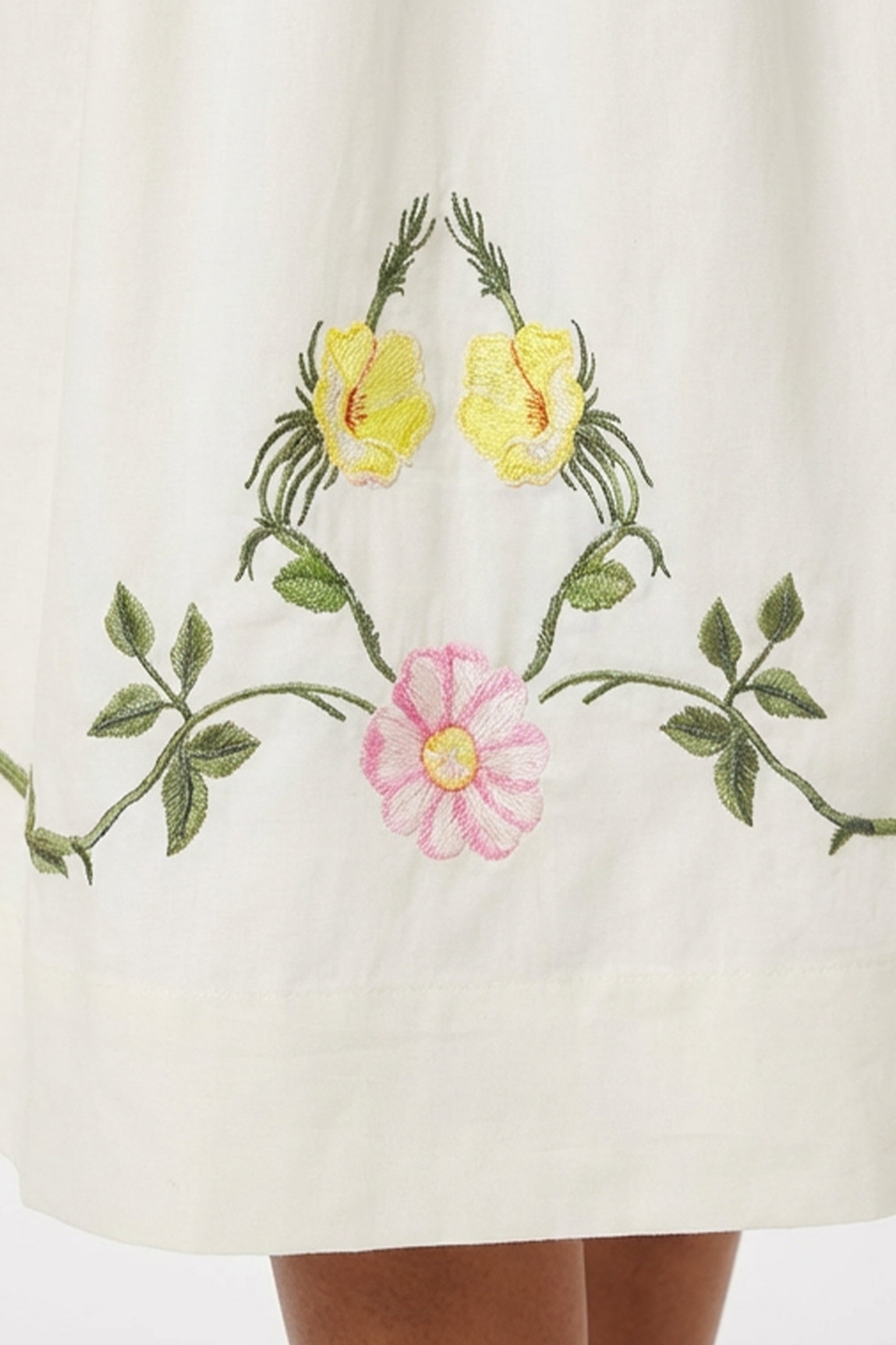 Detail of the Floral Embroidery on Veda Dress by Fanm Mon that wraps the bottom hemline.