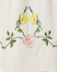 Detail of the Floral Embroidery on Veda Dress by Fanm Mon that wraps the bottom hemline.