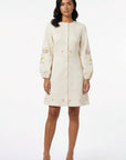 Fanm Mon Verona Dress featuring hand-placed floral embroidery, covered button-front detailing, and a tailored A-line mini silhouette.