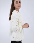 Fanm Mon Winter Bloom Yellow Hand knit Cardigan with all love floral embroidery detail, side view.