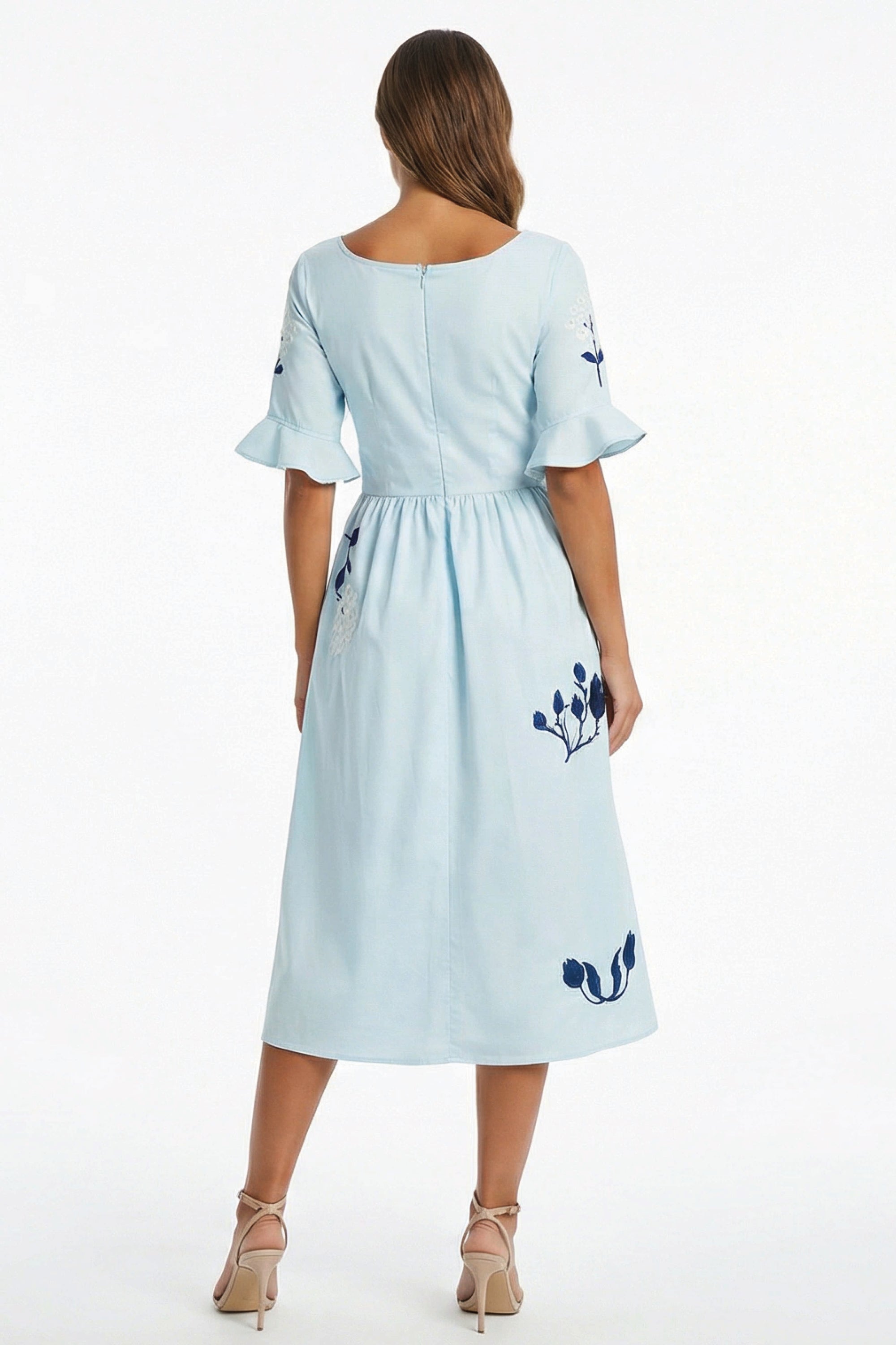 Back view of the Fanm Mon Yaprak Dress showcasing the gathered waist, flared sleeves, and embroidered floral details.