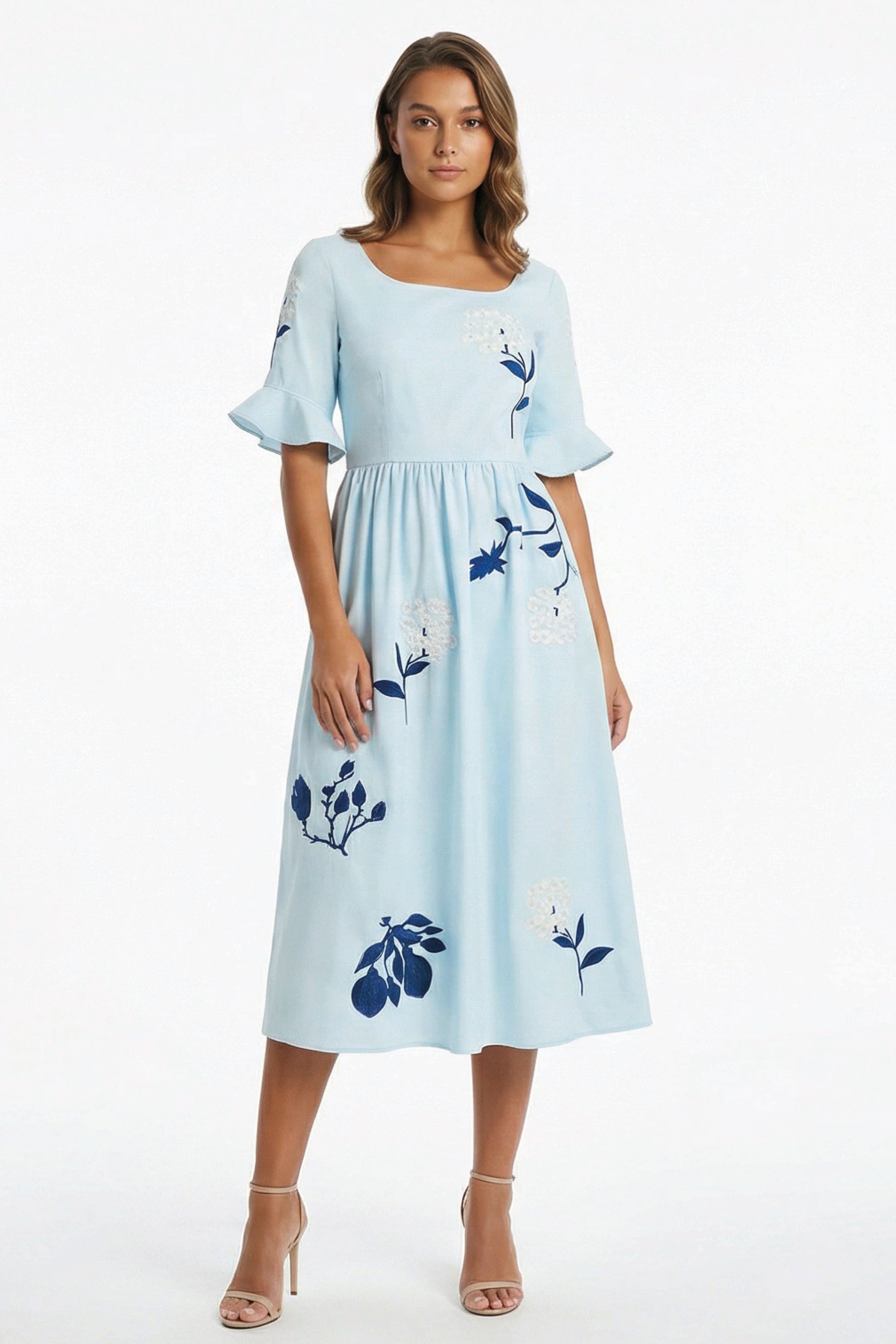 Fanm Mon Yaprak Dress featuring hydrangea embroidery, square neckline, flared sleeves, and flowing midi silhouette.