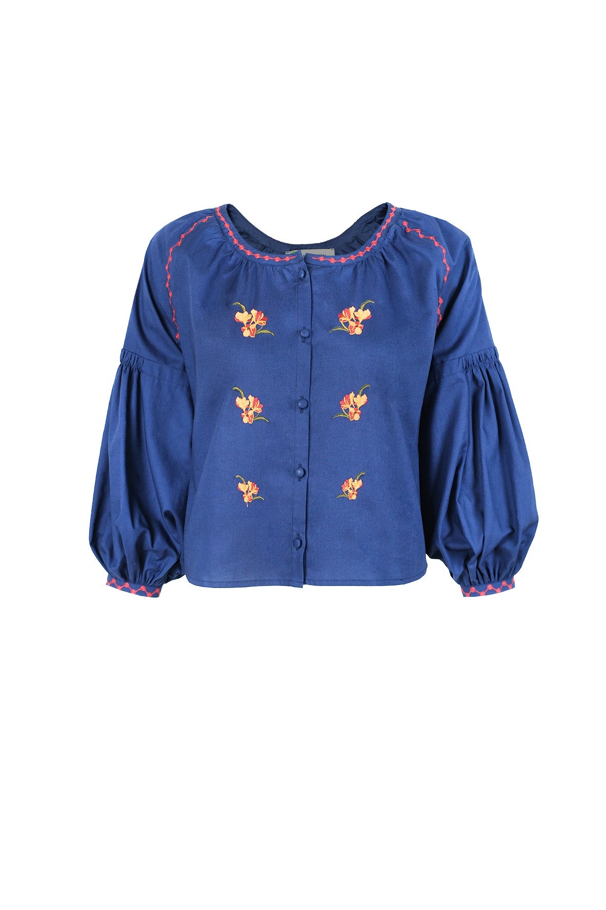 Fanm Mon Akik Top in blue with floral embroidery, covered buttons and voluminous sleeves