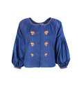 Fanm Mon Akik Top in blue with floral embroidery, covered buttons and voluminous sleeves