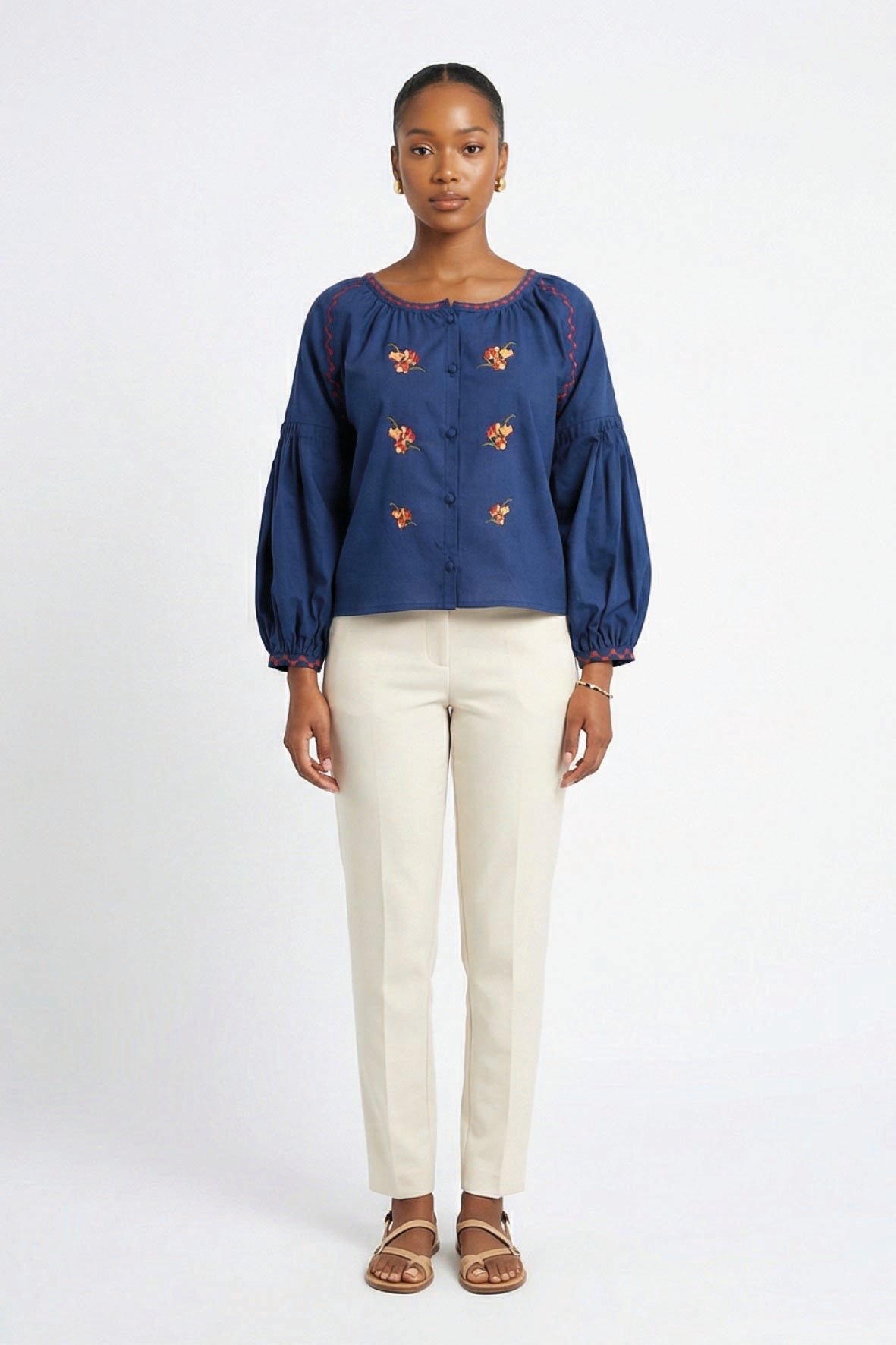 Model wearing Fanm Mon Akik Top with fire floral embroidery and voluminous long sleeves