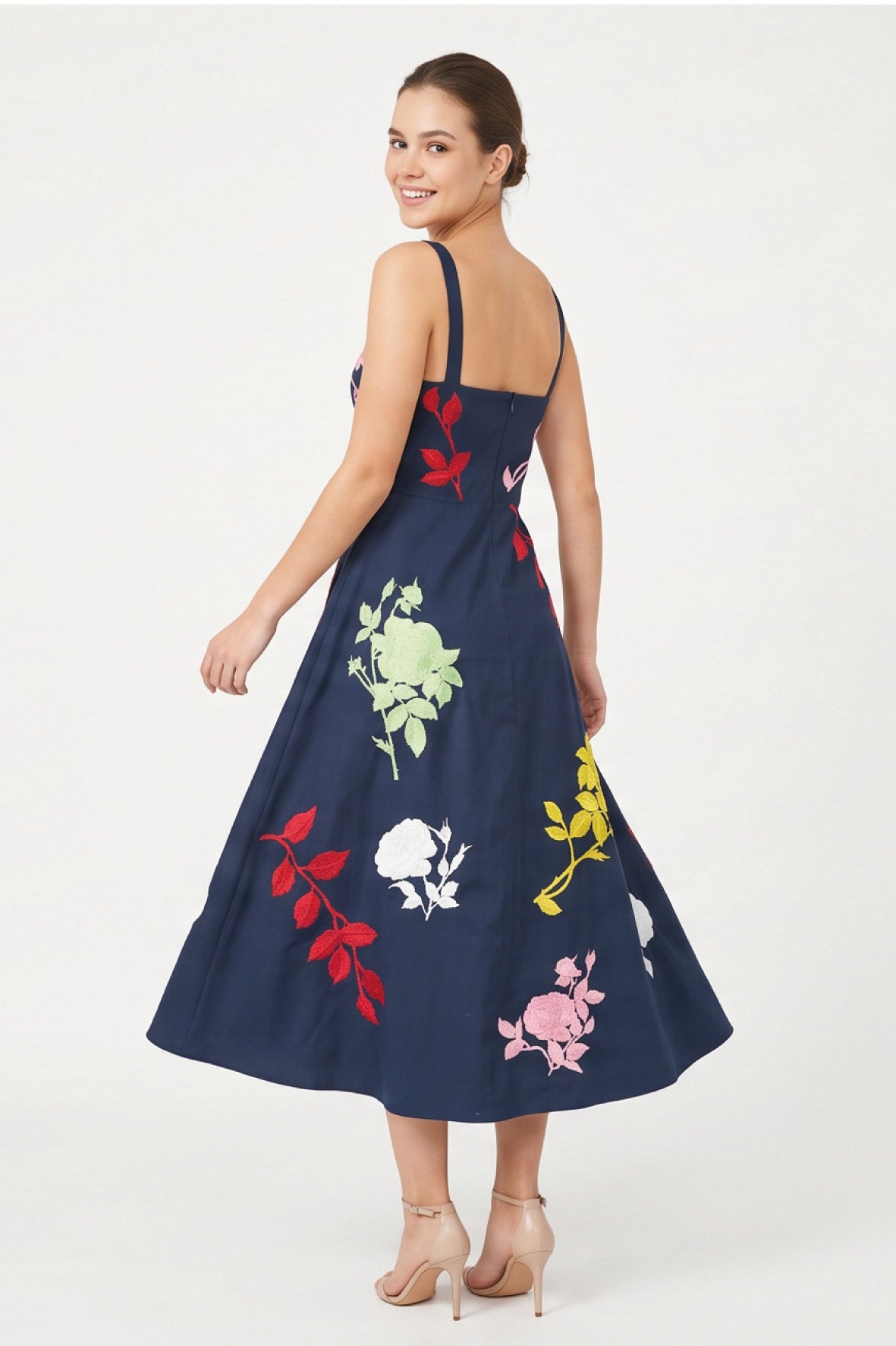Back view of the Fanm Mon Atike Dress with wide straps, fitted bodice and multicolored floral embroidery.