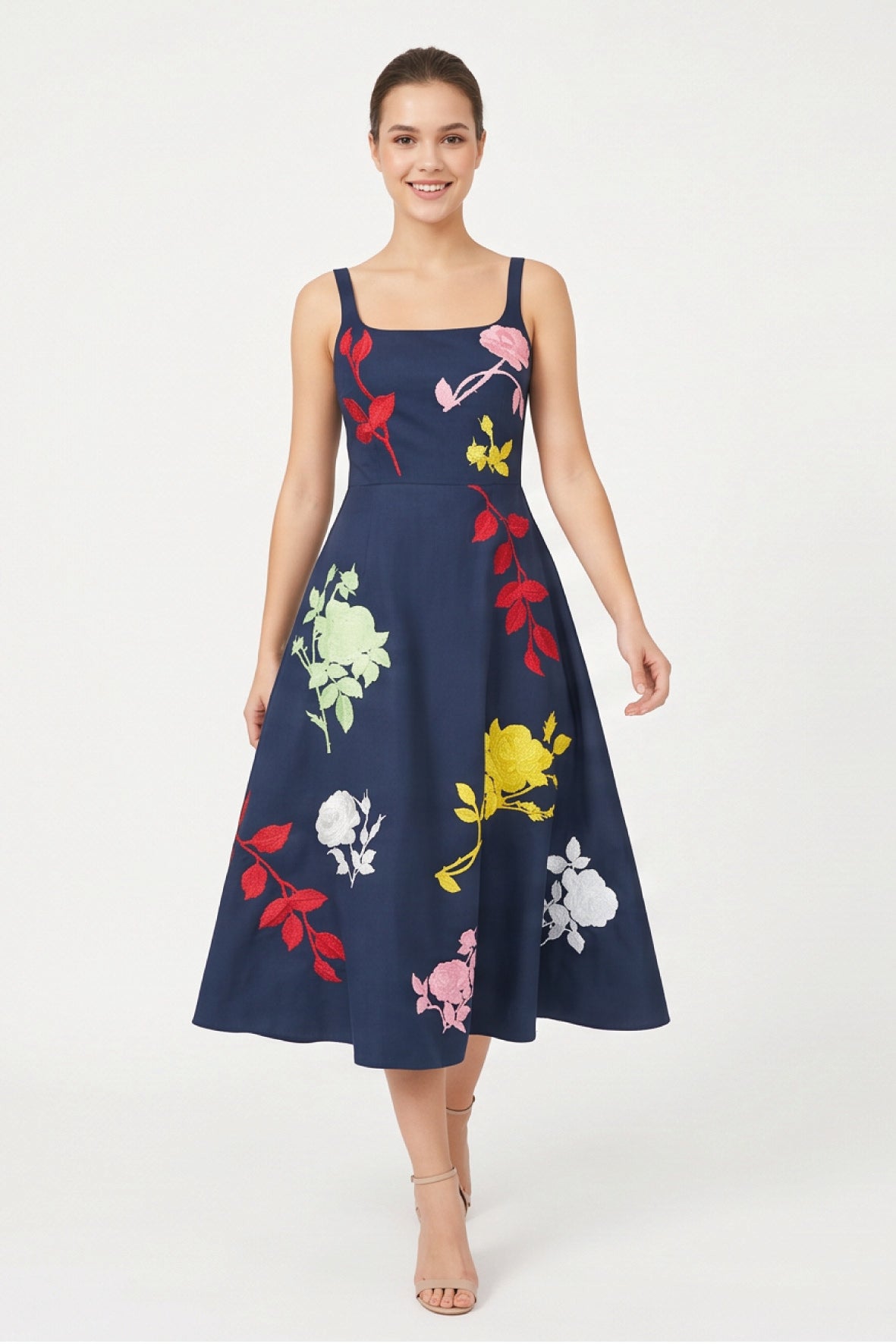 Model wearing the Fanm Mon Atike Dress with multicolored floral embroidery, fitted square-neck bodice and full midi skirt.