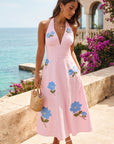 Model wearing Fanm Mon Ayna Dress in Light Pink while heading to a wedding overlooking the sea.