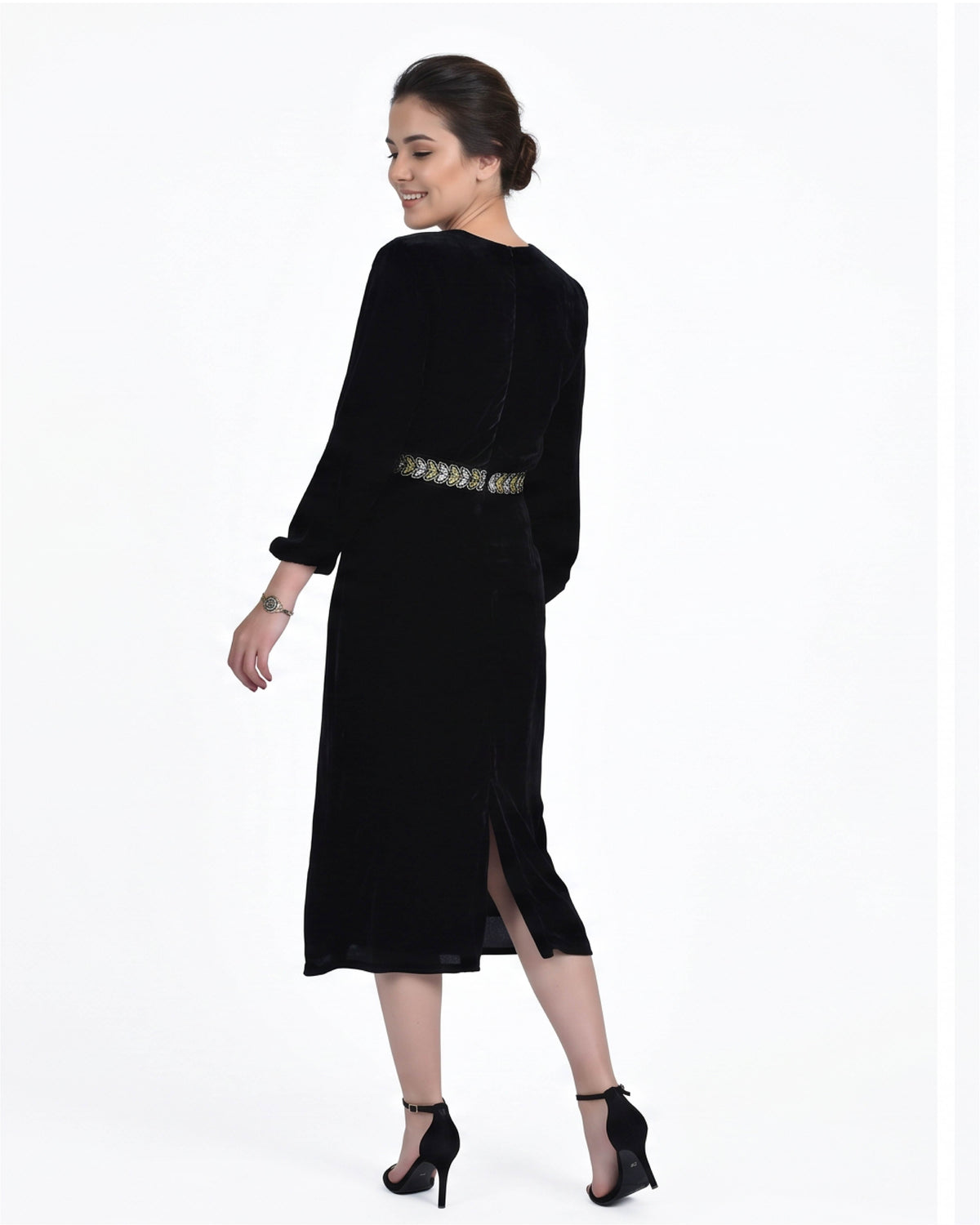 Fanm Mon Ezgi Dress back view in black velvet featuring long sleeves, embroidered waist detail and a midi silhouette with side slit
