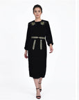 Fanm Mon Ezgi Dress on model in black velvet featuring rose embroidery, long sleeves, an embroidered waist and midi silhouette