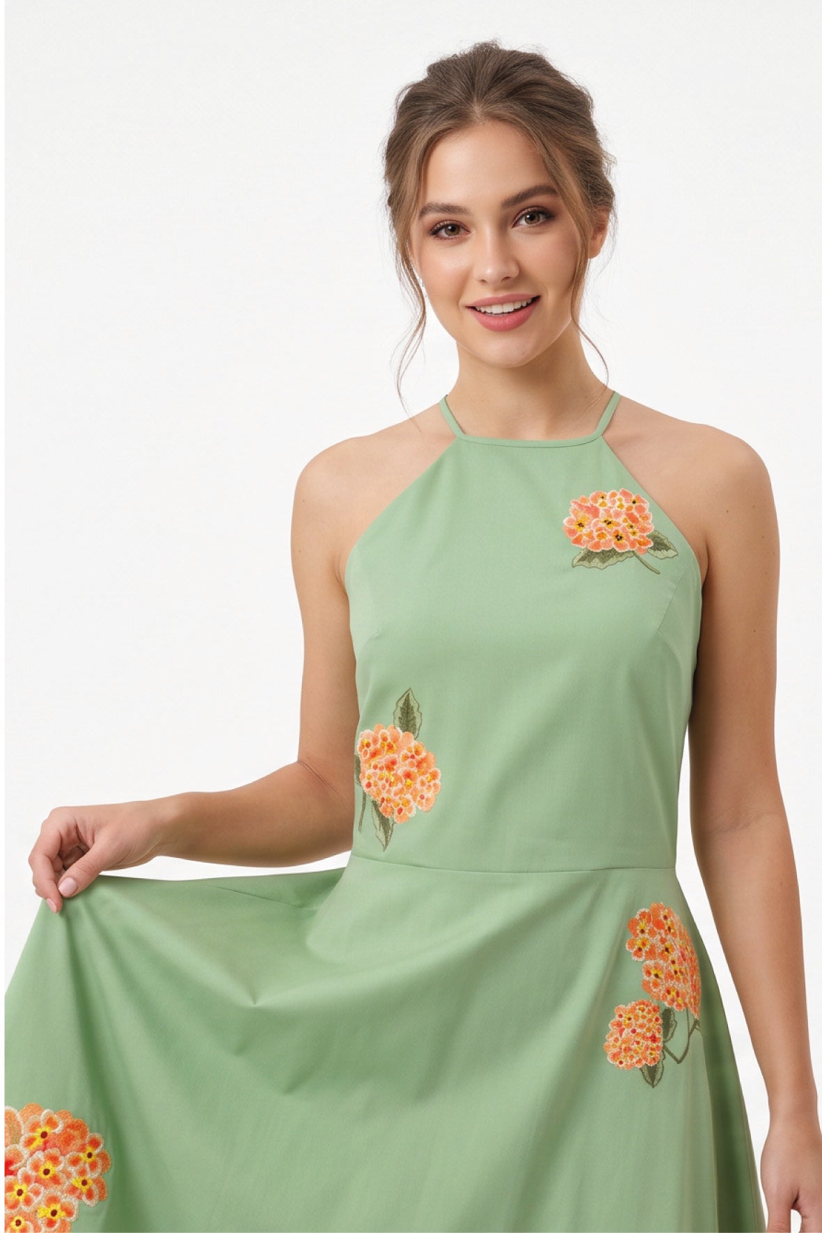 Detail of the Fanm Mon Fora Dress featuring orange hydrangea embroidery and a delicate halterneck silhouette.