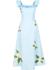 Fanm Mon July Dress in light blue featuring a ruffled neckline that can be worn on or off the shoulders, white floral embroidery, and an A-line midi silhouette