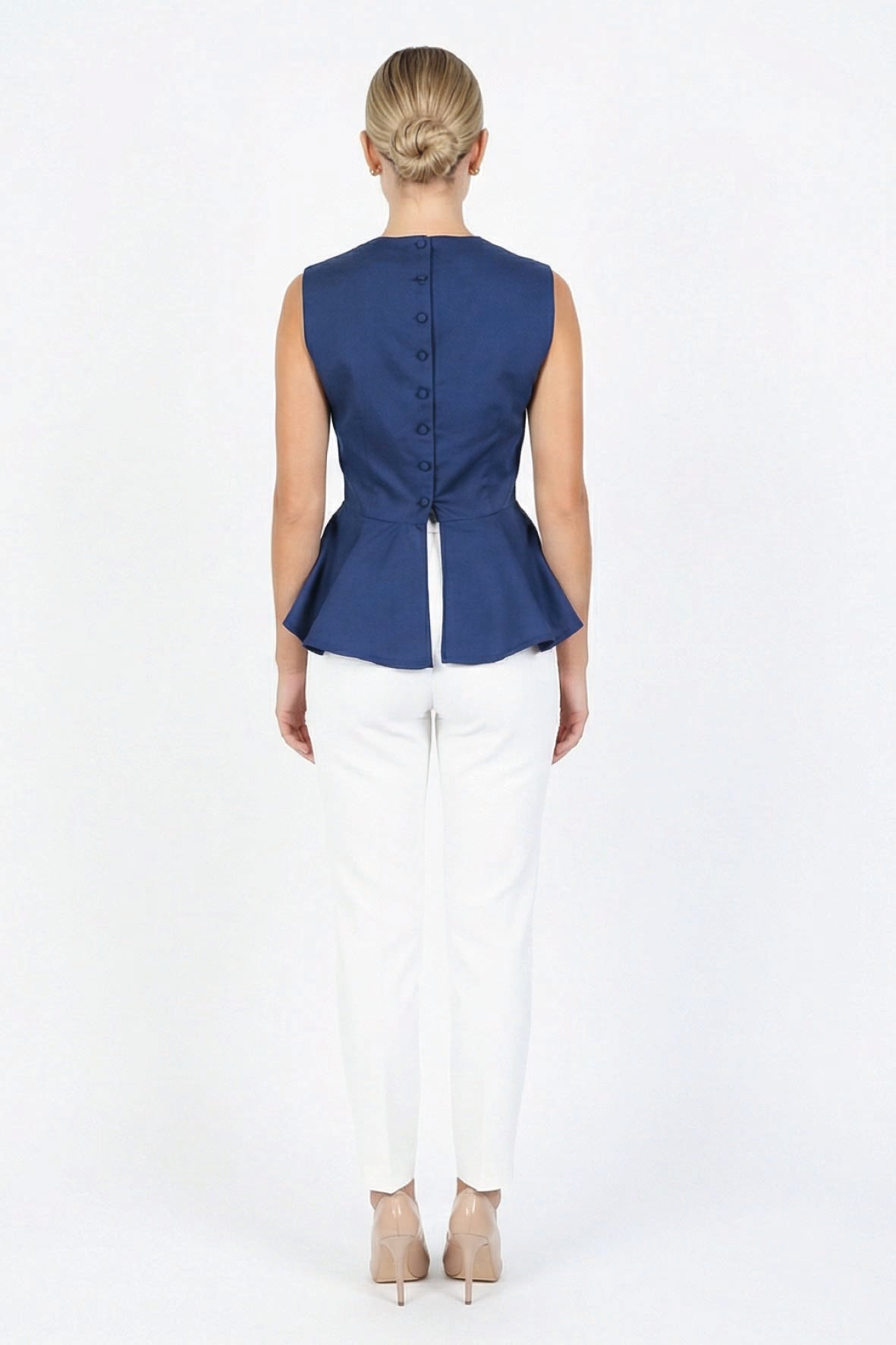Back view of Fanm Mon Marena peplum top in deep blue with fabric-covered buttons