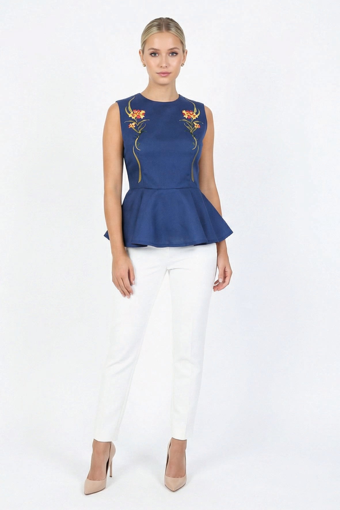 Fanm Mon Marena floral embroidered peplum top in deep blue on model