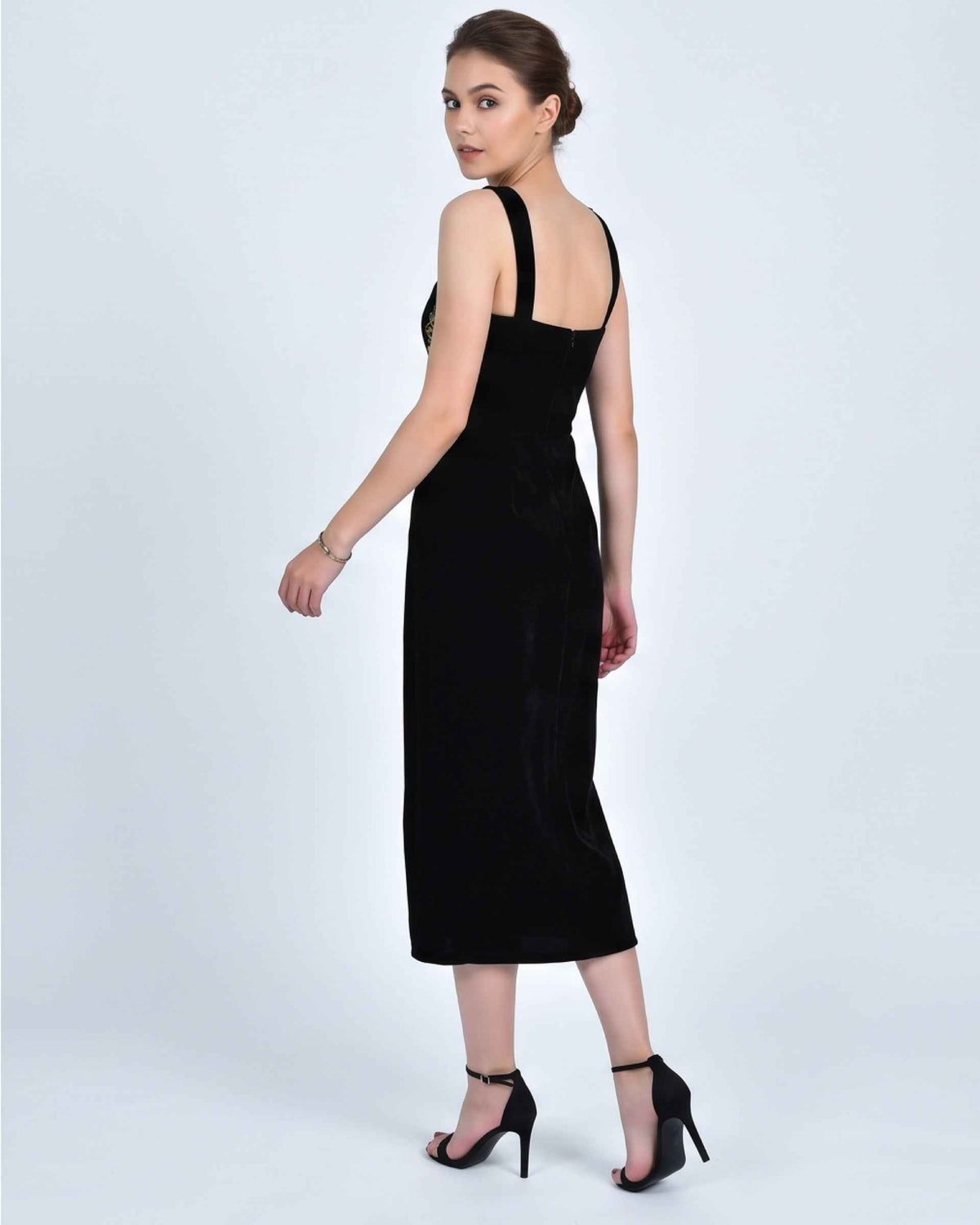 Fanm Mon Meltem Dress back view in black velvet featuring wide shoulder straps, a fitted silhouette, back zipper and midi length
