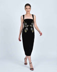 Fanm Mon Meltem Dress on model in black velvet featuring gold and silver rose embroidery, a square neckline and fitted midi silhouette