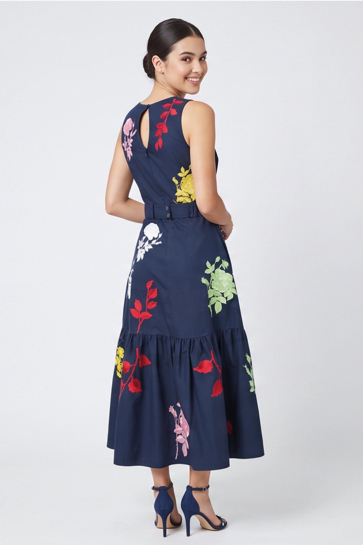 Back view of Fanm Mon Mihrap Dress featuring colorful floral embroidery, keyhole neckline and tiered skirt