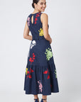 Back view of Fanm Mon Mihrap Dress featuring colorful floral embroidery, keyhole neckline and tiered skirt