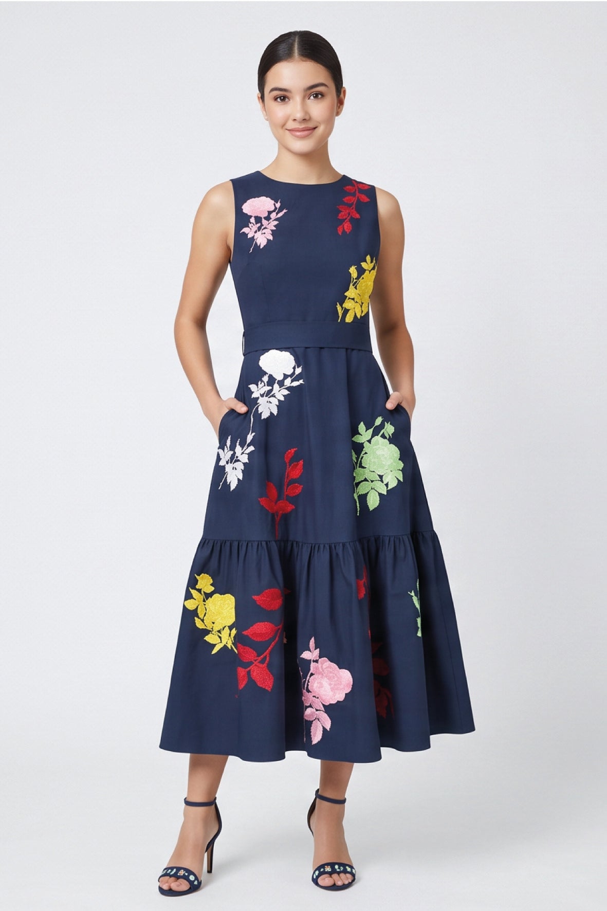 Model wearing Fanm Mon Mihrap Dress with colorful botanical embroidery, tiered skirt and side pockets