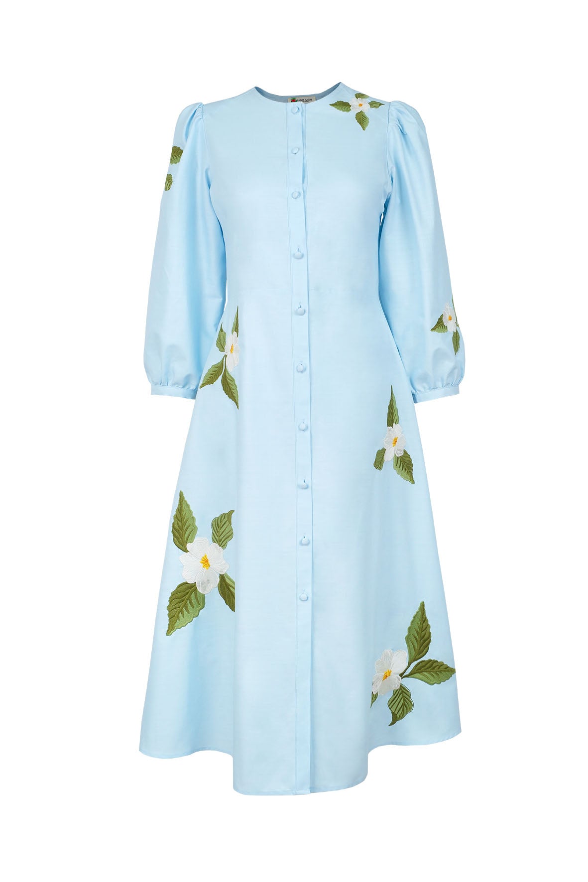 Fanm Mon Paysan Dress in light blue with white embroidered flowers, green foliage, fabric-covered buttons, and puff sleeves