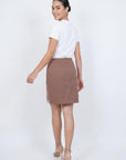 Fanm Mon Roya Skirt back view on model featuring a high waist, clean mini silhouette and concealed back zipper
